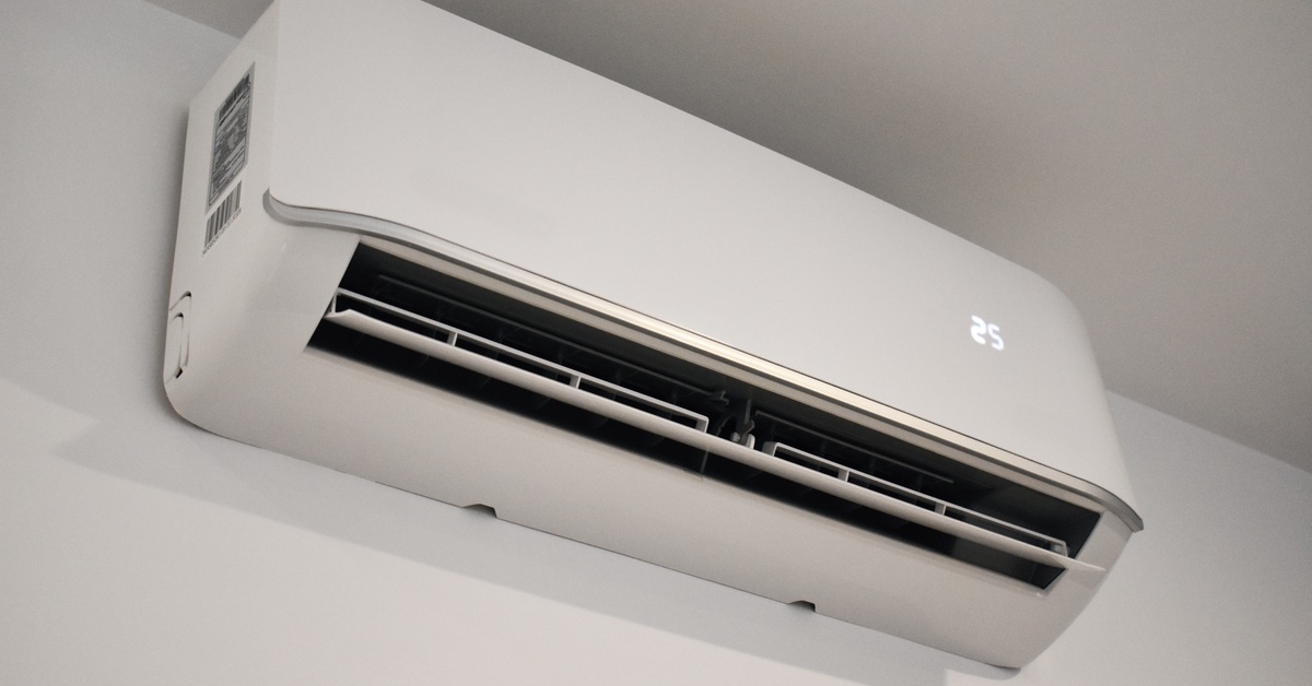 A white mini split AC system attached to a white wall. The number 25 appears on the right side of the unit.